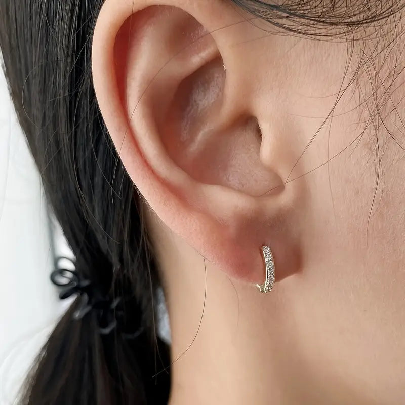 Orecchini pendenti in oro ispirati alla costa